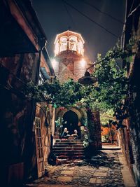 Alley amidst old buildings in city