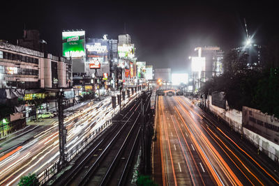 High angle view of light trails in city at night