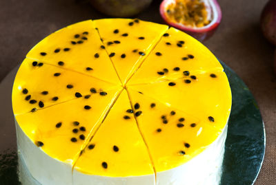 High angle view of cake with passion fruits on table