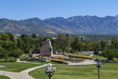 High angle view of townscape and mountains against clear sky