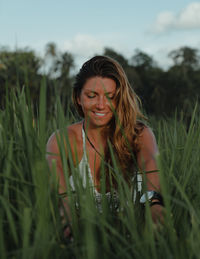 Portrait of smiling woman on field