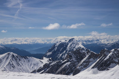 Scenic view of snow covered mountains against sky