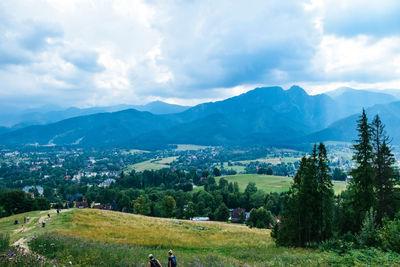 Scenic view of landscape and mountains against sky