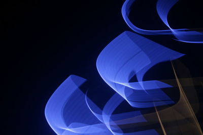 Close-up of light painting against black background