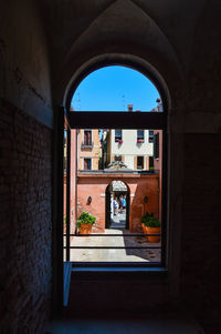 View of historic building seen through window