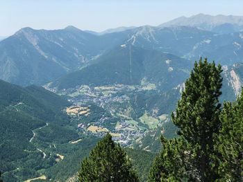 High angle view of valley and mountains against sky