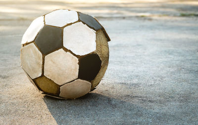 Close-up of soccer ball on sand