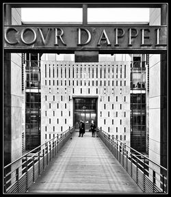 People walking on building in city