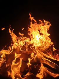 Close-up of bonfire against black background