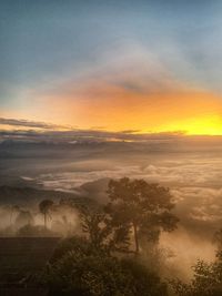 Scenic view of landscape against sky during sunset