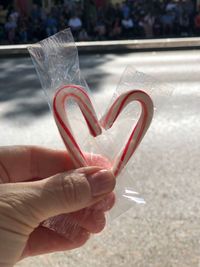 Close-up of hand holding heart shape