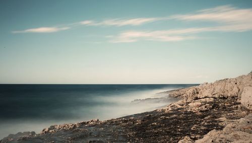 Scenic view of beach and sea against sky