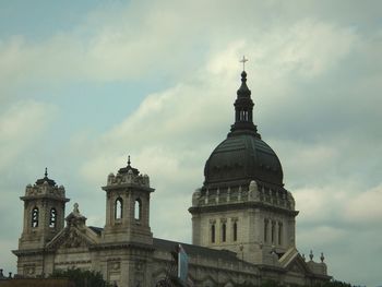 Low angle view of building against cloudy sky