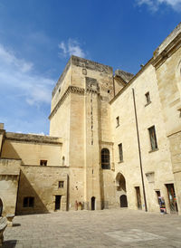 Low angle view of old ruins against sky