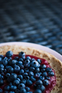 Close-up of blueberries in bowl on table