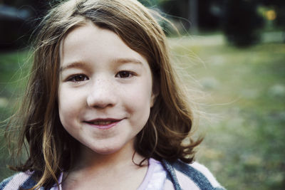 Portrait of smiling girl in park