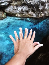 Close-up of hand on rock