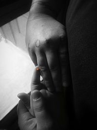 Close-up of person holding hands