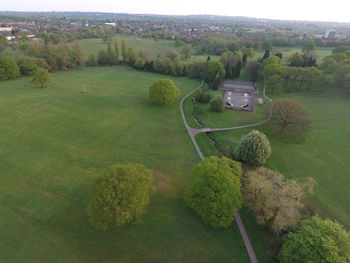 High angle view of golf course on field against sky