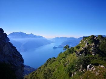 Scenic view of mountains against clear blue sky