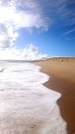 Scenic view of beach against sky