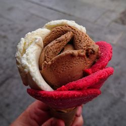 Close-up of hand holding ice cream