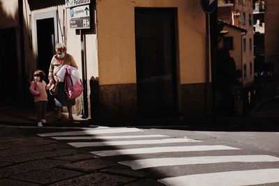 Women walking on street in city