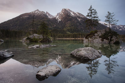 Scenic view of lake and mountains against sky