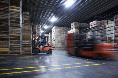 Man on forklift in factory hall