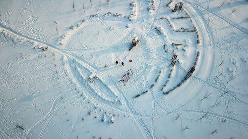 High angle view of tire tracks in snow