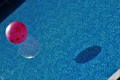 High angle view of ball on blue table