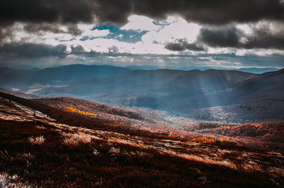 Aerial view of landscape against cloudy sky