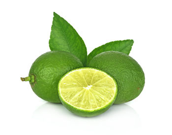 Close-up of lemon slice against white background