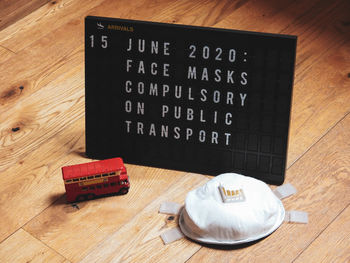 High angle view of information sign on table