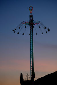 View on chain swing ride at sunset