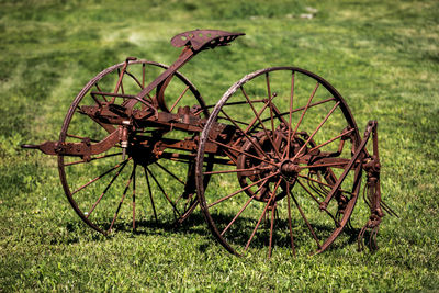 Rusty wheel on field
