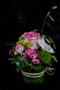 Close-up of pink rose bouquet against black background