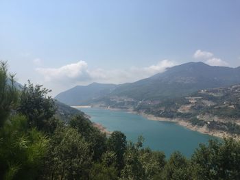 Scenic view of lake and trees against sky