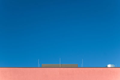 Low angle view of built structure against blue sky