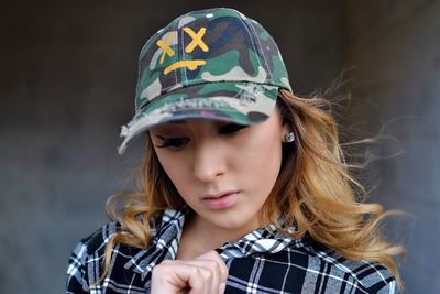 Close-up of girl wearing hat
