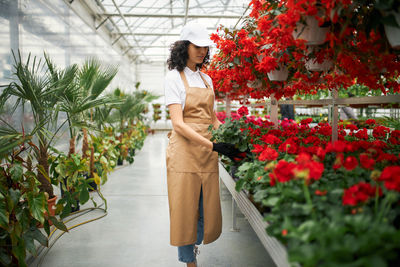 Woman standing in greenhouse