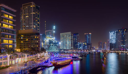 Illuminated buildings in city at night