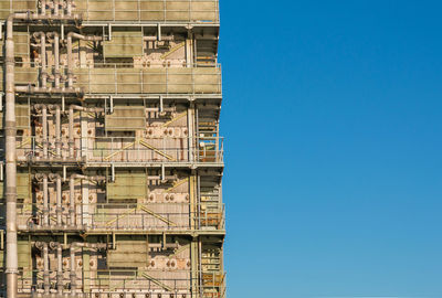 Low angle view of building against clear blue sky