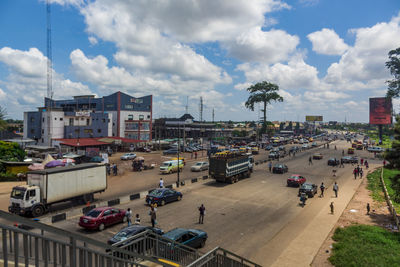 High angle view of vehicles on road along buildings