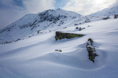 Scenic view of snowcapped mountains against sky