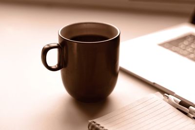 Close-up of coffee cup on table