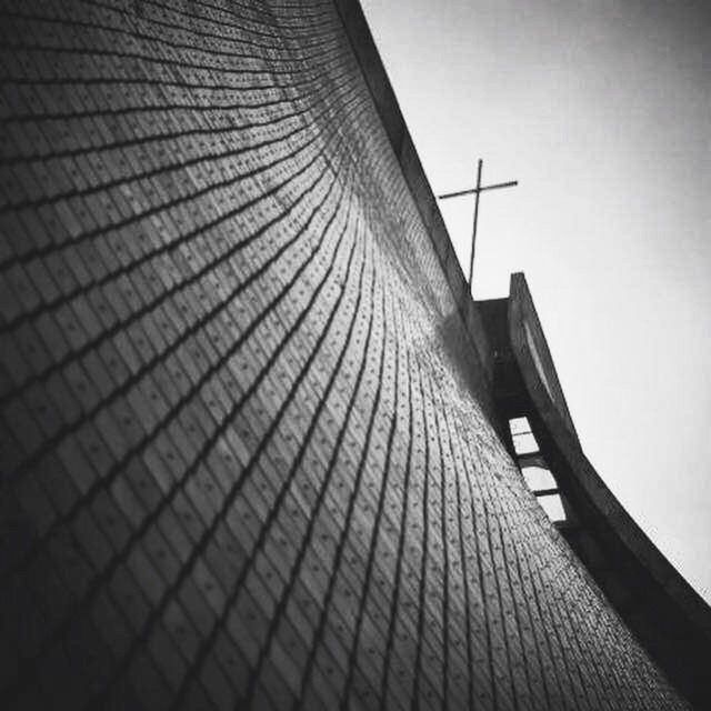 architecture, built structure, low angle view, building exterior, clear sky, sky, tall - high, tower, no people, building, outdoors, day, modern, sunlight, city, tall, architectural feature, pattern, skyscraper, staircase