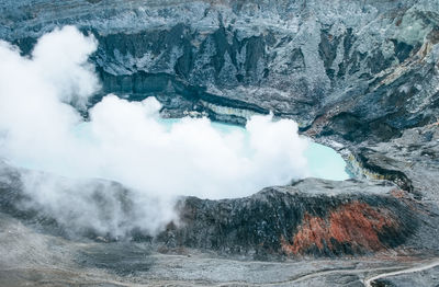 High angle view of lake amidst rock formation