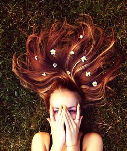 Woman standing on grassy field