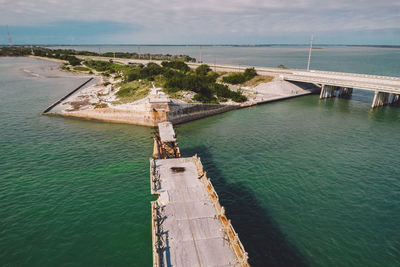 Bridge over sea against sky